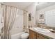 Bathroom with shower and vanity with sink and lighting at 238 Acadia Dr, Poinciana, FL 34759
