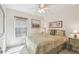 Bedroom with window and two pieces of art hanging on the wall at 238 Acadia Dr, Poinciana, FL 34759