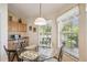 Breakfast nook with glass table and chairs featuring lots of natural light at 238 Acadia Dr, Poinciana, FL 34759
