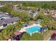 Aerial view of community pool with ample seating and lush landscaping throughout the community at 238 Acadia Dr, Poinciana, FL 34759