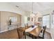 Dining room features tile floors, chandelier, and open access to other rooms at 238 Acadia Dr, Poinciana, FL 34759