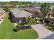 Charming single-story home with lush lawn, mature landscaping, and brick paver driveway offers great curb appeal at 238 Acadia Dr, Poinciana, FL 34759