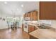 Kitchen with breakfast nook featuring wooden cabinets, and lots of natural light at 238 Acadia Dr, Poinciana, FL 34759