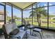 Enjoy the view from this screened-in patio with comfortable seating and scenic water view at 238 Acadia Dr, Poinciana, FL 34759