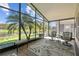 Relaxing screened-in patio with comfortable seating and scenic water view at 238 Acadia Dr, Poinciana, FL 34759