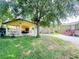 Relaxing backyard with a covered patio, perfect for outdoor dining and gatherings at 2406 Thelma Ave, Haines City, FL 33844