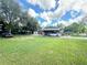 Home with a large yard and covered parking for convenience at 2406 Thelma Ave, Haines City, FL 33844