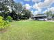Lush, sprawling yard with ample space and a charming home at 2406 Thelma Ave, Haines City, FL 33844
