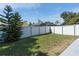 Spacious backyard with a privacy fence and green grass at 2432 Olive Branch Way, Orlando, FL 32817