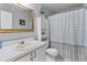 Bathroom featuring shower curtain, cabinets and sink at 2432 Olive Branch Way, Orlando, FL 32817