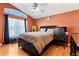 Cozy bedroom with natural light, ceiling fan and computer desk at 2432 Olive Branch Way, Orlando, FL 32817