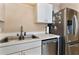 Kitchen featuring stainless steel appliances and a double sink at 2432 Olive Branch Way, Orlando, FL 32817