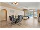 Open-concept living room with tile flooring and sliding glass doors to the pool area at 2432 Olive Branch Way, Orlando, FL 32817
