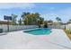 Backyard pool with a white fence and mature trees at 2432 Olive Branch Way, Orlando, FL 32817