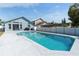 Backyard pool with large patio area and view of the home's exterior at 2432 Olive Branch Way, Orlando, FL 32817