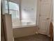 A bathroom features a soaking tub and ample natural light at 2520 Azzurra Ln, Ocoee, FL 34761