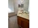 Bathroom vanity with granite countertop and decorative flowers at 2520 Azzurra Ln, Ocoee, FL 34761
