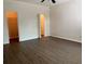 Spacious bedroom features wood-look flooring and two walk-in closets for ample storage at 2520 Azzurra Ln, Ocoee, FL 34761