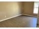 Bedroom featuring neutral walls, a window for natural light, and wood-look flooring at 2520 Azzurra Ln, Ocoee, FL 34761