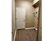 A laundry room with shelving, and wood-look flooring at 2520 Azzurra Ln, Ocoee, FL 34761