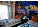 Bright bedroom featuring twin beds, a sea turtle mural, and tile floors at 2787 Oakwater Dr # 149, Kissimmee, FL 34747