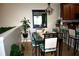 Dining room with table, chairs, light fixture, kitchen and plant at 2787 Oakwater Dr # 149, Kissimmee, FL 34747