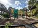 A delightful community playground area featuring slides, climbing structures, and ample space for recreational activities at 2787 Oakwater Dr # 149, Kissimmee, FL 34747