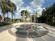 Fun splash pad surrounded by lush greenery, providing a refreshing outdoor water play area for residents at 2787 Oakwater Dr # 149, Kissimmee, FL 34747