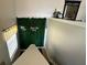 Bright stairwell features an accent wall with artificial ivy and natural light at 2787 Oakwater Dr # 149, Kissimmee, FL 34747