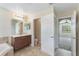 Main bathroom features a vanity with access to a toilet room and bedroom at 30439 Gidran Ter, Mount Dora, FL 32757