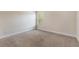 Bedroom with carpet, neutral walls, and a single window looking out onto trees at 30439 Gidran Ter, Mount Dora, FL 32757