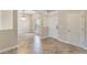 Open-concept foyer with tile flooring, neutral walls, and decorative chandelier at 30439 Gidran Ter, Mount Dora, FL 32757