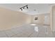 Spacious living room featuring tile floors, neutral walls, and lots of natural light at 31 Las Palmas Way, Kissimmee, FL 34743