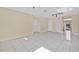 Bright living room with tile flooring, neutral walls, and multiple storage closets at 31 Las Palmas Way, Kissimmee, FL 34743