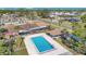 A private rectangular in-ground pool is surrounded by lush landscaping and fencing in this backyard oasis at 31 Las Palmas Way, Kissimmee, FL 34743