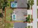 Bird's eye view of property with screened pool, showcasing layout and backyard at 310 N Hampton Dr, Davenport, FL 33897