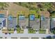 Aerial view of several homes each featuring its own screened-in pool, neatly arranged in a suburban neighborhood at 310 N Hampton Dr, Davenport, FL 33897