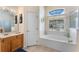 Bathroom showcases a soaking tub under a window plus a separate shower at 310 N Hampton Dr, Davenport, FL 33897
