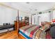 Well-lit bedroom includes a dark-wood four-poster bed and wood floors at 310 N Hampton Dr, Davenport, FL 33897