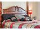 Comfortable bedroom featuring a classic four-poster bed and warm, inviting decor at 310 N Hampton Dr, Davenport, FL 33897