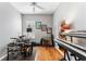 Bonus room with musical instruments, hardwood floors, and a ceiling fan at 310 N Hampton Dr, Davenport, FL 33897