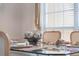 Dining table setting with decorative centerpieces, plates, and neutral decor at 310 N Hampton Dr, Davenport, FL 33897