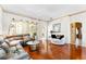 Spacious living room with hardwood floors, comfortable seating, and ample natural light at 310 N Hampton Dr, Davenport, FL 33897