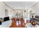 Inviting living and dining areas with hardwood floors, decorative molding, and plenty of space at 310 N Hampton Dr, Davenport, FL 33897