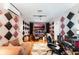 Carpeted music studio with speakers, monitors, and a comfortable gaming chair at 310 N Hampton Dr, Davenport, FL 33897