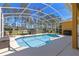 Inviting screened-in pool area with comfortable seating and a serene outdoor space perfect for relaxation and entertaining at 310 N Hampton Dr, Davenport, FL 33897