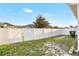 Fenced backyard with green grass and gate at 3131 Bass Boat Way, Kissimmee, FL 34746