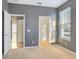 Bedroom with neutral carpet and large window for ample natural light at 3131 Bass Boat Way, Kissimmee, FL 34746