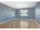 Bright dining room with tile flooring, large windows, and a modern chandelier fixture at 3131 Bass Boat Way, Kissimmee, FL 34746