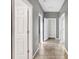 Hallway with tiled floors and white doors at 3131 Bass Boat Way, Kissimmee, FL 34746
